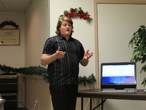 Lynden Beardwood explains how the Gananoque BIA's new website works last Thursday night at the Gananoque BIA's annual general meeting.