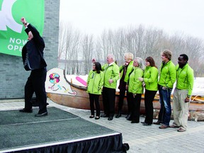 Algonquin College governor Fred Blackstein (left) breaks a bottle of champagne to signal the official opening of Algonquin College in the Ottawa Valley’s waterfront campus as students past and present (from left) Karishma Daya, Dan Cotnam, Pam Duplessis, Jayne Brophy, Dee Colborne, Jason Blaine and Jean Barasubiye.