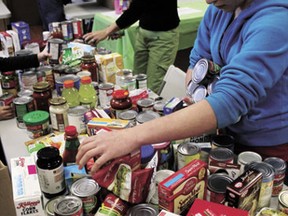 Volunteers sorted masses of non-perishable food, collected as part of a food drive benefitting the Calmar Christmas Elves in Calmar on Saturday, Nov. 23. The items were stored in the depot at the Scouts Hall.