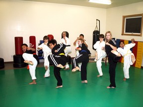 Can-Te Karate students demonstrate competition winning technique at the Seventh Avenue South dojo Tuesday following the club’s outstanding showing at the Canadian All Martial Open competition in Winnipeg, Nov. 24.
REG CLAYTON/Daily Miner and News