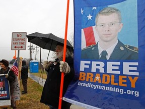 Supporters of U.S. Army Pfc. Bradley Manning protest during his scheduled motion hearing, outside the gates of Fort Meade, Maryland November 27, 2012.  REUTERS/Jose Luis Magana