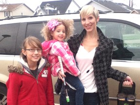 Kathi Dziadura Blackwell is pictured with two of her five children, Mia Janay, 11, and Layne, 3, while on the way to hockey with the Eco on the Go reusable tote for carrying takeout drinks. The new product is being sent to 20 Hollywood celebrities by Hollywood's No. 1 celebrity gifters Jewels and Pinstripes. Contributed Photo.