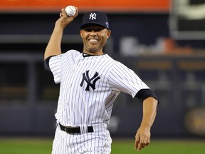 Injured New York Yankees closer Mariano Rivera throws out the ceremonial first pitch before Game 3 of their MLB ALDS baseball playoff series against the Baltimore Orioles in New York, October 10, 2012. (REUTERS/Ray Stubblebine)