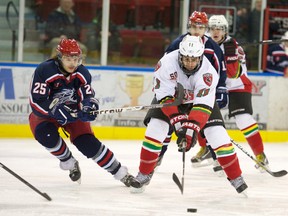 Robert Lefebvre photo
Cornwall Colts Pierre Ouellette (25) tries to disturb Kanata Stallions Derian Plouffe during Thursday’s CCHL game at the civic complex, won by the Colts 8-4.