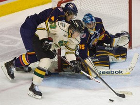London Knights forward Bo Horvat outmuscles Barries?s Alex Lepkowski for the puck in front of Colts goalie Mathias Niederberger during the second period of their OHL game Nov. 30, 2012 at the Budweiser Gardens. (MIKE HENSEN, The London Free Press)