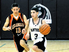 McGregor Panthers' Nate St. Pierre, right, is shadowed by L'Essor Aigles' Belal Halibi in a first-round game in the Chatham Sports Hall of Fame senior boys basketball tournament Saturday at McGregor. (DIANA MARTIN/The Daily News)