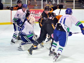 Sudbury Nickel Barons goalie Alexander Laino juggles the puck after stopping a shot deflected by Peter Poulin Roy, of the Abitibi Eskimos, during the first period of Saturday’s NOJHL game at the Tim Horton Arena in Cochrane. Nickel Barons defenders Brett Dusick, left, and David Lazarus are outnumbered in front of the crease by Eskimos Richard Therrien, from left, Poulin-Roy and Bryce Robert. The Eskimos defeated the Nickel Barons 7-0.