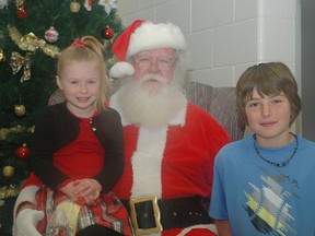 Sparta P.S siblings Ruby and George Denniss with Santa Claus during the Alzheimer Society fo Elgin-St. Thomas's Breakfast with Santa Sunday morning. (Nick Lypaczewski Times-Journal)
