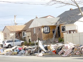 A home in Freeport N.Y. still clearing out wall board and insulation four weeks after the flood caused by Superstorm Sandy. Contributed Photo cdn.newsroom@sunmedia.ca