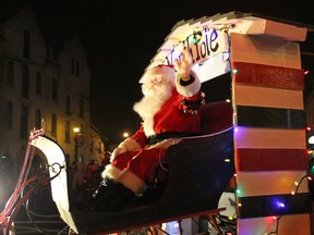 Santa Claus waves to the hundreds of spectators at the Paris Santa Claus Parade on Saturday, Dec. 1, 2012 in Paris, Ontario. MICHAEL PEELING/THE PARIS STAR/QMI AGENCY