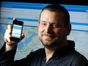 Web-App developer Sean Kibbee shows off his OCBusTracker.com app, which tracks OC Transpo buses in Ottawa.  The app is getting over 55,000 requests per month from riders. (Darren Brown/Ottawa Sun)