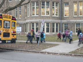 Pupils arrive at Lord Roberts French Immersion Public School for class at the Princess Avenue school in London on Friday November 30, 2012.  Elementary school teachers across the province are set to take work to rule action on Monday. (CRAIG GLOVER, The London Free Press)