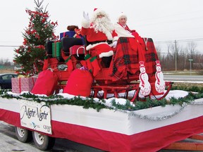 Santa Claus came to town with Mrs. Claus during the annual Santa Claus Parade in Morrisburg on Saturday morning.
Staff photo/ERIKA GLASBERG