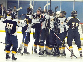 TERRY FARRELL/DAILY HERALD-TRIBUNE
Teammates surround and congratulate Connor Goudeau on his historic shutout. The Grande Prairie Storm beat the Lethbridge Pronghorns 5-0 at Dave Barr Arena on Saturday. It was the first shutout for the Storm since joining the Alberta Midget (AAA) Hockey League in 2007.