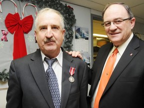 Community member Norman Byrnes was given the Queen's Jubilee 60th Anniversary Medal for his volunteer work with the local food bank, Telecare and through his church, Our Lady of Hope, he was awarded the medal by Nickel Belt MP Claude Gravelle.   GINO DONATO/THE SUDBURY STAR