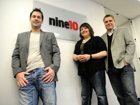 Adam Jackson/Daily Herald-Tribune
Ryan Blais, formerly of GoSocial, stands with Cris Seppola and Richard Podsada of nine10 Incorporated pose for a photo at the nine10 office at 214 Place. The two sides recently announced that GoSocial will merge into nine10.