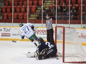 Brennen Bosovich of the Melfort Mustangs skates away after scoring on a penalty shot against the Kindersley Klippers on December 1, 2012.