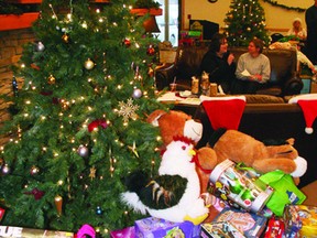 Gifts and donations to the local Salvation Army pile up under the tree at the 22nd annual Miracle Marathon hosted by 89.5 The Lake at the Super 8 Minis Hall Friday and Saturday. 
GARETT WILLIAMS/Kenora Daily Miner and News