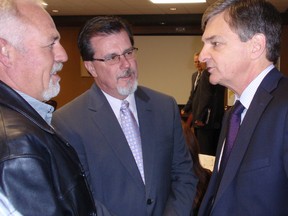Simon Bruinsma (left) and Jim Hogan (centre) of Entegrus of Chatham, On. chat with Ontario Energy Minister Chris Bentley prior to the minister's speech Monday, December 3, 2012, at a breakfast meeting sponsored by the Chatham-Kent Chamber of Commerce at the John D. Bradley Convention Centre. (Bob Boughner Chatham Daily News)