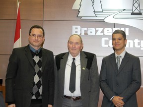 On Nov. 28 two regulatory specialists from the Brazilian National Agency of Petroleum, Natural Gas and Biofuels (ANP) visited Brazeau County as part of an educational tour of the province to learn how Alberta sets regulatory practices of onshore operations. Left to right: Carlos Cabral, Reeve Wes Tweedle, and Luciano Teixeira.