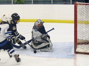 Banff Minor Hockey’s Keifer Miller snaps one into the back of the Canmore net on Sunday, Dec. 2, during the Smyth Family Invitational Novice Tournament at the Fenlands Rec Centre. Banff won the game 4-1, bringing their tournament record to 2-2. LARISSA BARLOW/ BANFF CRAG & CANYON/ QMI AGENCY