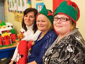 Sharon Moran, Executive Director Cathy Vanstone, and Sheila Mitchell of the Tupper St. Family Resource Centre sit in the Children's play area of the centre on Monday. The organization is planning three events this holiday season for families to enjoy.
(Svjetlana Mlinarevic/The Daily Graphic/QMI Agency)