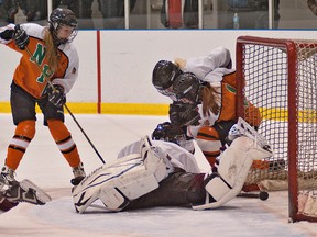 BRIAN THOMPSON, The Expositor

North Park's Kacie Harrison (left) watches her shot trickle over the goal line past a sprawling Pauline Johnson goalie, Olivia Benson, during high school girls hockey Monday at the Wayne Gretzky Sports Centre.