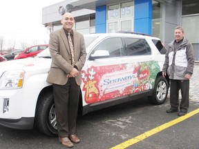 Seaway GMC is helping keep the streets safe with Operation Red Nose. Sales consultants Trevor Mayer and Mike Lalonde stand with the car donated for the cause.
Staff photo/KATHRYN BURNHAM