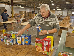 BRIAN THOMPSON, The Expositor

Arie Vanderstelt, warehouse distribution co-ordinator at the Christmas Baskets program, sorts through food donations on Monday.  The program provides Christmas food hampers to needy families in Brantford and surrounding area.