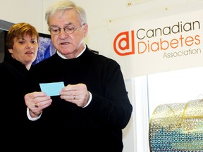 Coun. Mike Doody reads a winner's name at Imerys Talc's Just in Time for Christmas Raffle campaign, as Imerys employee and fundraising committee member Penny Loyer looks on. In benefit of the Timmins chapter of the Canadian Diabetes Association (CDA), $4,170 was raised by Imerys employees thanks to the efforts.
