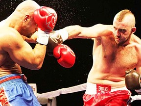 Canadian heavyweight Dillon "Big Country" Carman, right, goes to work against opponent Peter Erdos during a recent boxing match in Mississauga. (Photo by blog.canadianboxiana.com)