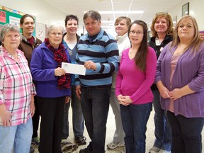 Representatives from Tillsonburg schools, the Tillsonburg Kiwanis Club, Delmer United Church and the Oxford County Nutrition Partnership were on hand Monday for a cheque presentation at Annandale Public School. The $1,000 donation in honour of Norm Smith, was received by the Kiwanis Club from the UCW at Delmer United Church. The Tillsonburg Kiwanis Club returned the money back to the community, by donating it to the breakfast program at local schools. From left, Sheila Schwab (Rolph Street), Lynda Metcalfe (Oxford County Nutrition Partnership), Patti Harkes (M.S O'Neil), Onalee Bye (UCW Delmer Church), Ina Vanharen (St. Joseph's), Mike Dean (Kiwanis Club). Moy Harries (South Ridge), Linda Nevado (Rolph Street), Tamara Bull (Annandale School), and Melissa Barras (Maple Lane School). 

KRISTINE JEAN/TILLSONBURG NEWS/QMI AGENCY