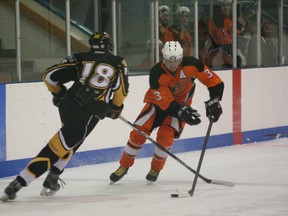 Tanner Bjorklund of the Fairview Flyers tries to dodge Wyatt Anderson of the Fort St. John Huskies during NWJHL hockey action at the Fairplex arena in Fairview on Friday, Nov. 30, 2012. It was the first of two games for the Flyers that week. (Simon Arseneau/Fairview Post)