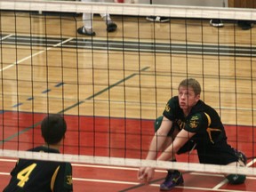 Mitchell Luck (right) playing volleyball for the St. Thomas More Kodiaks. Mitchell will be playing at the high school all-star game in Grande Prairie on this Thursday, Dec. 6, 2012. His father Doug Luck will also be coaching one of the teams at the annual game. (Simon Arseneau/Fairview Post)