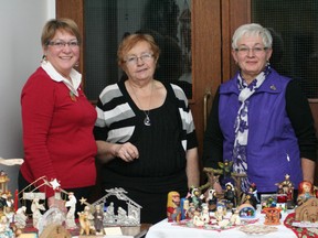 (From left to right) Event organizers Donna PrÈvost, Val Becher and Linda Nicholson stand behind nativity displays during the St. Thomas More Church Tea & Bake Sale on Saturday, Dec. 1, 2012. The event was organized by the Catholic Women’s League. (Simon Arseneau/Fairview Post)