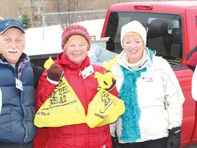 This crew of volunteers for the Elliot Lake Fire Service Christmas Food Drive was out on Saturday collecting bags of food.				         Photo by DAVID BRIGGS/FOR THE STANDARD