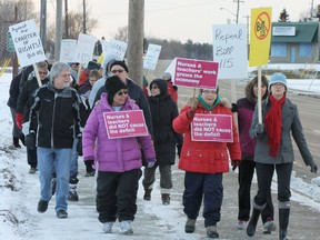 Teachers, nurse, hospital maintenance staff and supporters braved the chilly temperatures on Nov. 28 to let the public known they are opposed to the provincial Bill 115, that they believe is trying to take away their right to negotiate a contract.
Photo by KEVIN McSHEFFREY/THE STANDARD/QMI AGENCY