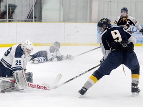 TERRY FARRELL/DAILY HERALD-TRIBUNE
Storm forward Kevin Yasinski gives Lethbridge goalie Jonny Hogue a snowshower along with a deflection of a Cole Weibe pass. Hogue made the toe save. The Grande Prairie Storm beat the Lethbridge Pronghorns 5-0 at the Dave Barr Arena on Saturday. It was the Storm’s first-ever shutout in Alberta Midget Hockey League play. The Storm joined the league in 2007 and Saturday’s game was the 191st in team history.