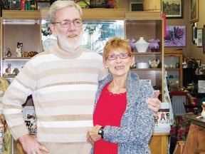 Carl MacIntyre and Hanna Rycroft, owners of Basket Case Cafe, stand in the middle of their shop during the store’s fifth anniversary. 
Staff photo/ERIKA GLASBERG