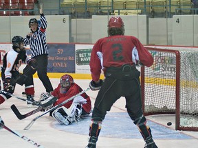 BRIAN THOMPSON, The Expositor

Paris goalie Reilly Biro looks over his shoulder to see the puck in the net during a high school boys hockey game against North Park on Tuesday at the civic centre.