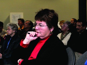 Linda Moseley listens to discussion at a public meeting Tuesday night on a proposed west-end residential subdivision (RONALD ZAJAC/The Recorder and Times).