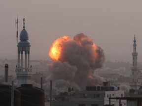 An explosion and smoke are seen after Israeli air strikes in Gaza City Nov. 17.