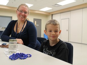 Volunteer Meg Zimmer works with Grade 1 student Greg Peplinski during a session of the Strong Start Reading program at Cobblestone Elementary School in Paris, Ontario on Wednesday, Nov. 21, 2012. Zimmer, a mother of four students at the school, and Greg are participating in the program's first year at Cobblestone. MICHAEL PEELING/THE PARIS STAR/QMI AGENCY