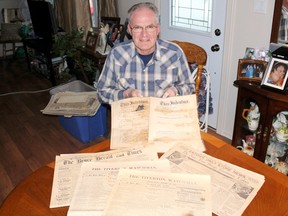 Tiverton’s Ron Roppel shows off a number of historical newspapers he has in a collection of local memorabilia. The most interesting issue, a copy of the Dec. 12, 1912 issue of the Tiverton Watchman that will be 100 years old next week, features a bylaw to declare Tiverton as a ‘dry’ village free of alcohol sales, which stayed in place for decades. (TROY PATTERSON/KINCARDINE NEWS)