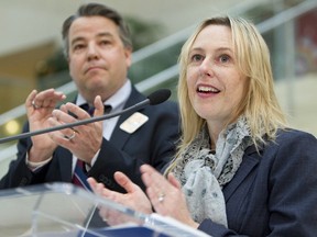 Coun. Dave Loken (left) and Coun. Kim Krushell spoke during the wrap of the Donate A Ride campaign at City Hall in Edmonton, Alberta, on April 13, 2012. This year, 66 local Edmonton charities are getting 91,120 ETS tickets worth $201,998. The tickets are purchased through donations from transit users and organizations.