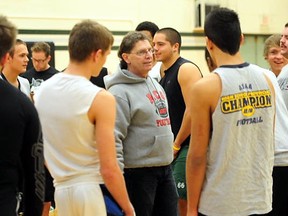 National scouting director for All Star football, Ron Dias (centre) talks to a group of high school football players at the Annual Edmonton All Star Football Combine at Austin O’ Brien high school on Saturday. TREVOR ROBB Edmonton Examiner