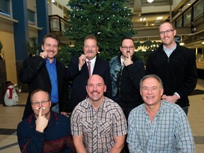 Members of Team HAIRdrie, including Kent Rupert (back row, far left) and Mayor Peter Brown (back row, second from left) display their moustaches at city hall on Friday. Some members had already shaved their ‘staches off. 
JAMES EMERY/AIRDRIE ECHO