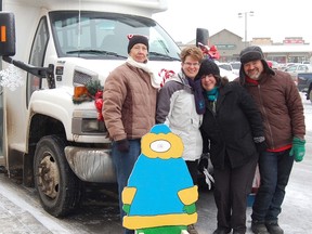 Pictured here at the Stuff-A-Bus event are Activettes Marg Sletten and Heather Fennell, and from the Cochrane and Area Events Society, Marlise Rockwell and Brooks Tower.