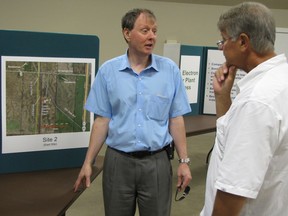 Hubert Vogt, vice-president of Eastern Power Limited, speaks with St. Clair Township Mayor Steve Arnold Thursday Aug. 16, 2012 during an open house at the Courtright Community Hall near Sarnia, Ont., held to provide the public with information about the natural gas-powered electricity plant the company plans to build in the township. The public can comment until Dec. 23 on whether the project should receive a federal environmental assessment.  PAUL MORDEN/THE OBSERVER/QMI AGENCY