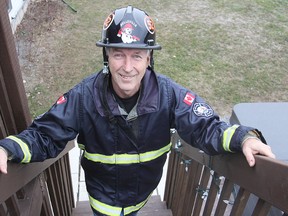 Michael Lea The Whig-StandardNewburgh's Brian Jones, who retired recently from the Belleville fire department, wears the gear he wears when competing in the firefighters' combat challenge.